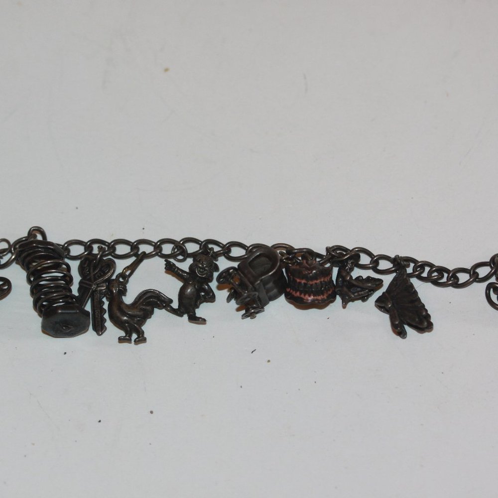 Vintage UNUSUAL Charm Bracelet 11 charms keys, teeth, rabbit, rooster, etc.